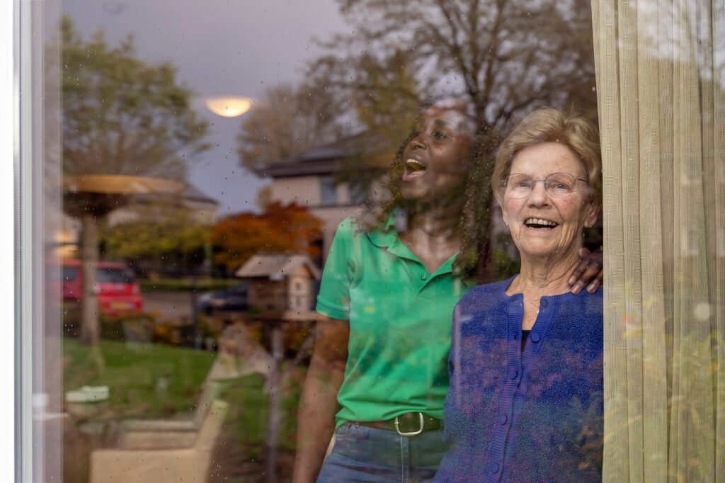 Helper caring for elderly lady